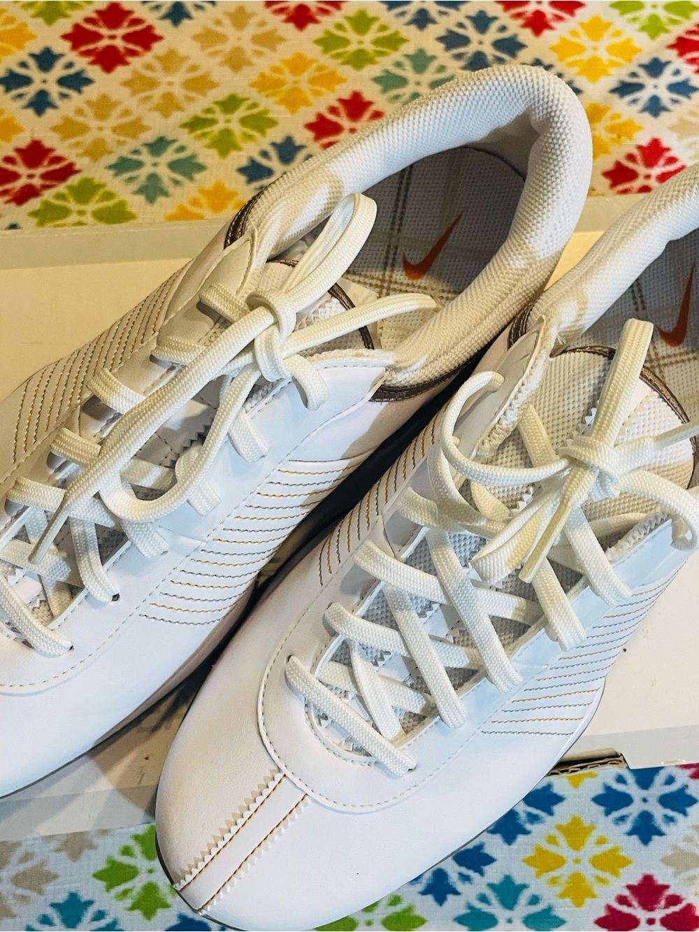 Nike White Athletic Sneakers with Orange Swoosh Detail